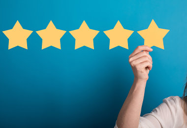 hand holding 5 star review